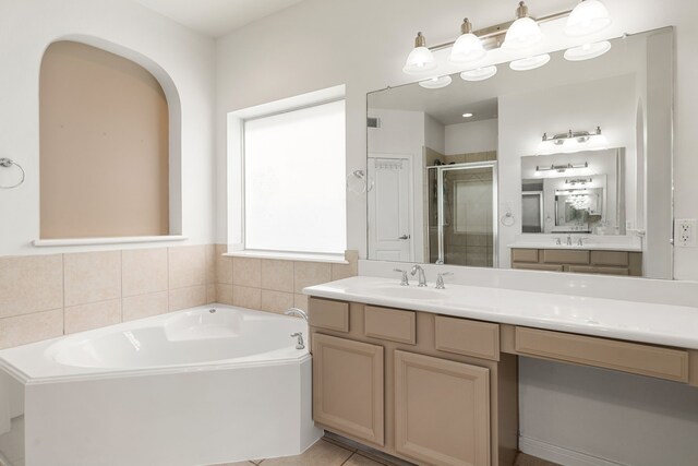 2107 Pearl Bay Ct, Pearland, TX 77584 - bathroom featuring a shower stall, a garden tub, vanity, and tile patterned floors