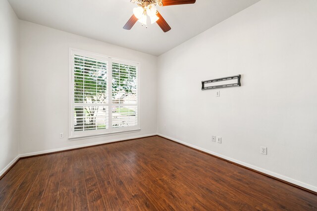 2107 Pearl Bay Ct, Pearland, TX 77584 - empty room featuring dark wood finished floors, baseboards, and ceiling fan