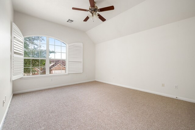 2107 Pearl Bay Ct, Pearland, TX 77584 - spare room featuring carpet, ceiling fan, lofted ceiling, and baseboards
