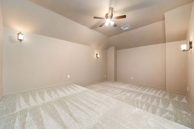 2107 Pearl Bay Ct, Pearland, TX 77584 - additional living space with light carpet, a ceiling fan, lofted ceiling, and baseboards