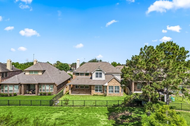 2107 Pearl Bay Ct, Pearland, TX 77584 - view of front of home featuring brick siding, a patio area, and a chimney