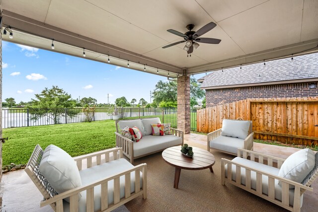 2107 Pearl Bay Ct, Pearland, TX 77584 - view of patio / terrace featuring an outdoor living space, a ceiling fan, and a water view