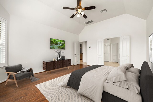 2107 Pearl Bay Ct, Pearland, TX 77584 - bedroom with wood finished floors, ceiling fan, baseboards, and high vaulted ceiling
