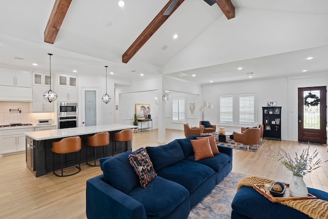 9603 Neon Moon Dr, Needville, TX 77461 - living room featuring beam ceiling, light wood finished floors, recessed lighting, and high vaulted ceiling