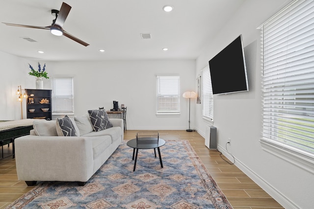 9603 Neon Moon Dr, Needville, TX 77461 - living room with wood finished floors, ceiling fan, recessed lighting, and baseboards