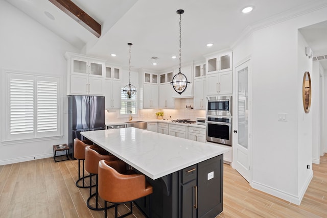 9603 Neon Moon Dr, Needville, TX 77461 - kitchen featuring stainless steel appliances, a sink, white cabinets, a kitchen island, and recessed lighting