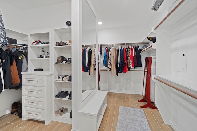 9603 Neon Moon Dr, Needville, TX 77461 - spacious closet featuring wood tiled floors