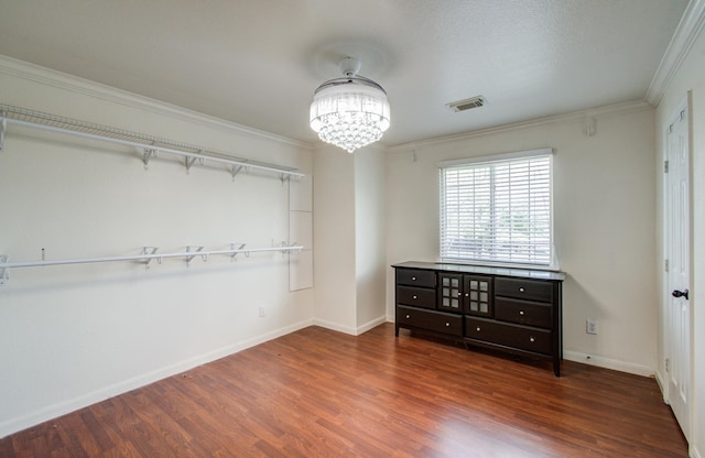 2519 Bradburn Hill Ln, Houston, TX 77014 - unfurnished bedroom featuring wood finished floors, a chandelier, ornamental molding, and baseboards