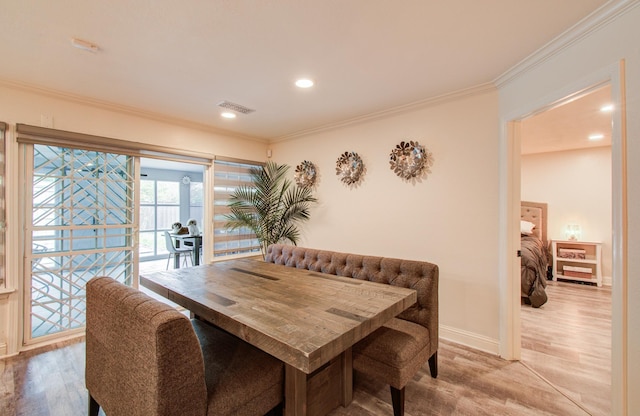 2519 Bradburn Hill Ln, Houston, TX 77014 - dining room featuring light wood-style floors, ornamental molding, recessed lighting, and baseboards