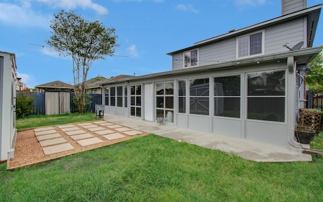 2519 Bradburn Hill Ln, Houston, TX 77014 - back of property featuring a sunroom, a patio area, and a chimney