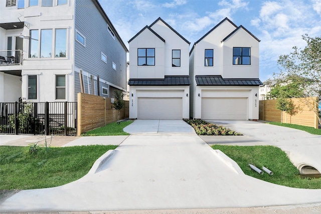 townhome / multi-family property featuring fence, concrete driveway, a standing seam roof, and an attached garage