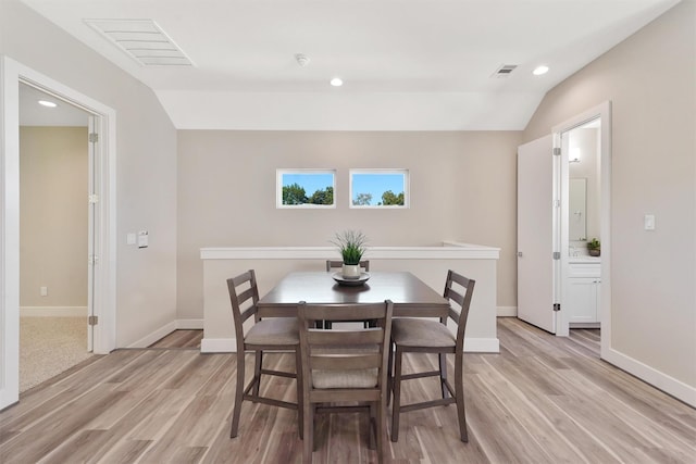 238 Julia St Unit E, Houston, TX 77022 - dining room with light wood-style floors, recessed lighting, baseboards, and lofted ceiling