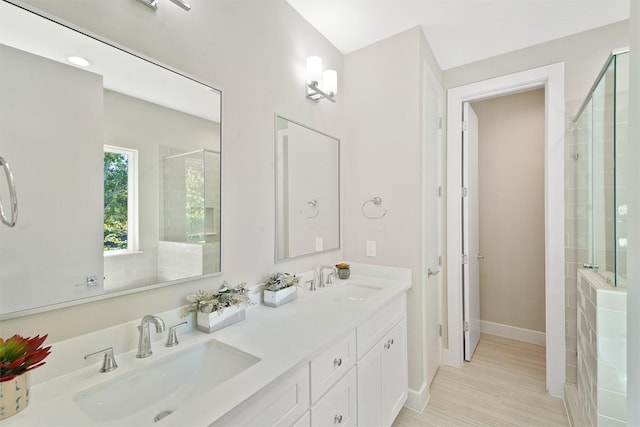 238 Julia St Unit E, Houston, TX 77022 - full bath with tiled shower, baseboards, and double vanity