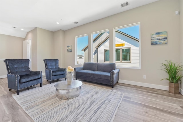 238 Julia St Unit E, Houston, TX 77022 - living area featuring light wood-style flooring, baseboards, and recessed lighting