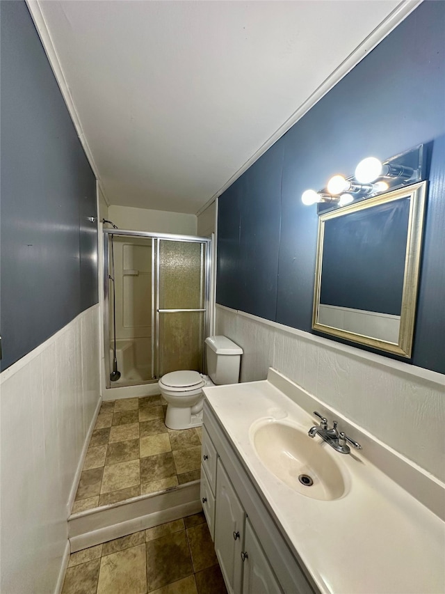 3605 Lawn Oak Dr, Orange, TX 77632 - full bath with a stall shower, a wainscoted wall, toilet, and vanity