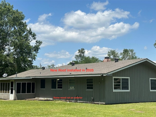 3605 Lawn Oak Dr, Orange, TX 77632 - rear view of house featuring a shingled roof, a lawn, a chimney, and a sunroom
