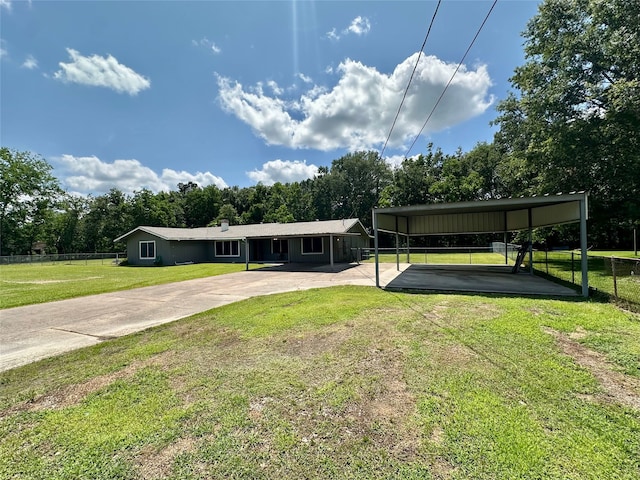 3605 Lawn Oak Dr, Orange, TX 77632 - view of front of property featuring driveway, a carport, and view of scattered trees