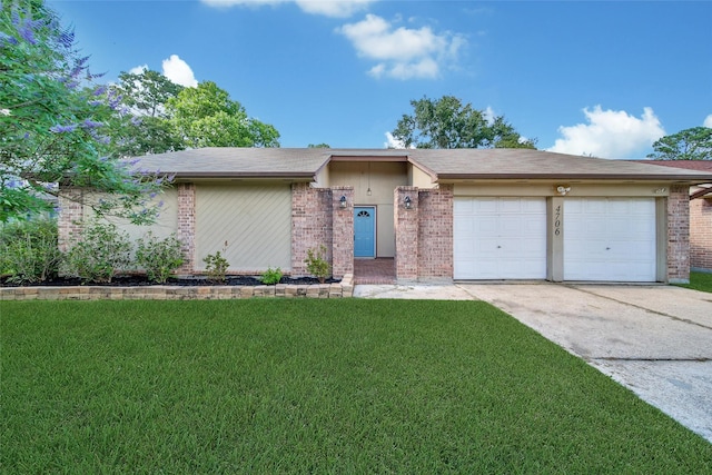 4706 Larksong Ln, Spring, TX 77388 - view of front of home with an attached garage, driveway, brick siding, and a front yard