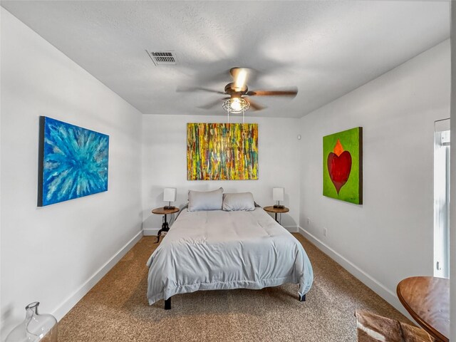 13537 Laramie Trl, Montgomery, TX 77316 - carpeted bedroom featuring baseboards and ceiling fan