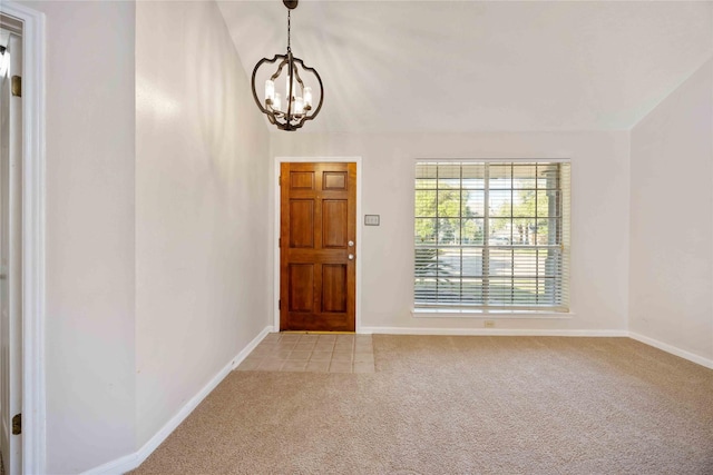17610 Mill Springs Dr, Spring, TX 77379 - foyer entrance featuring a chandelier, light colored carpet, and baseboards
