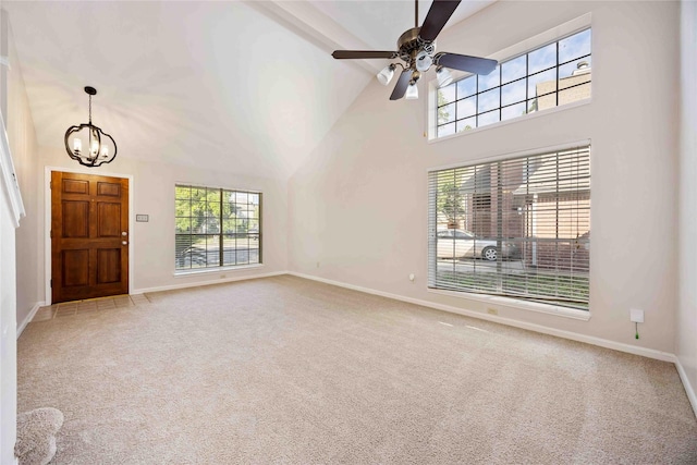 17610 Mill Springs Dr, Spring, TX 77379 - unfurnished living room featuring high vaulted ceiling, a chandelier, carpet floors, baseboards, and ceiling fan