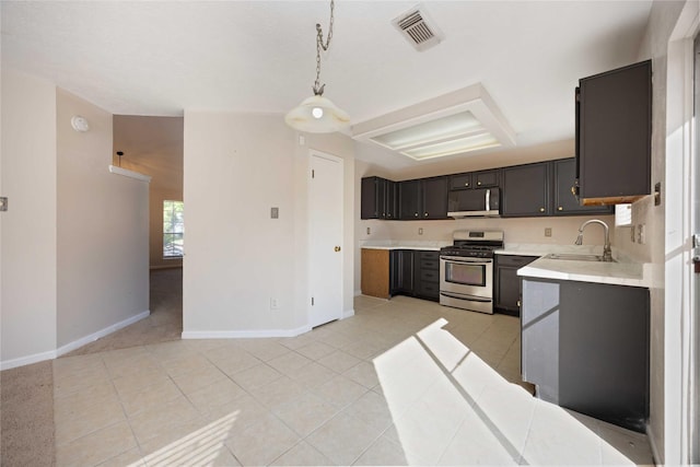 17610 Mill Springs Dr, Spring, TX 77379 - kitchen with stainless steel appliances, a sink, light countertops, baseboards, and light tile patterned flooring