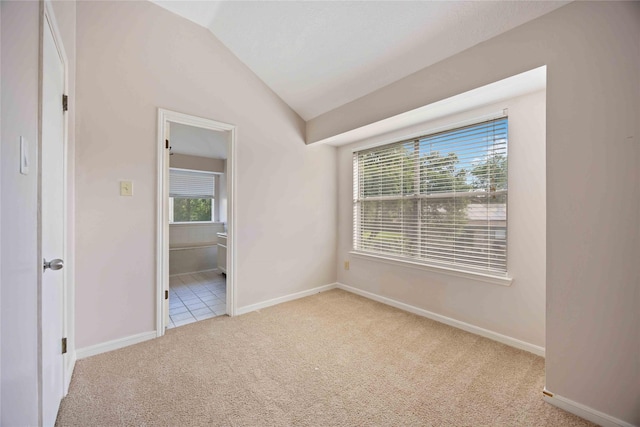 17610 Mill Springs Dr, Spring, TX 77379 - spare room with vaulted ceiling, carpet flooring, and baseboards