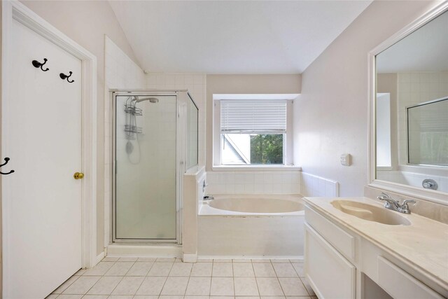 17610 Mill Springs Dr, Spring, TX 77379 - bathroom featuring a stall shower, tile patterned flooring, a bath, vaulted ceiling, and vanity