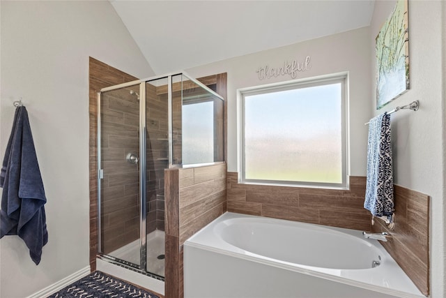 20122 Matador Ridge Dr, Cypress, TX 77433 - bathroom featuring a shower stall, a bath, and vaulted ceiling