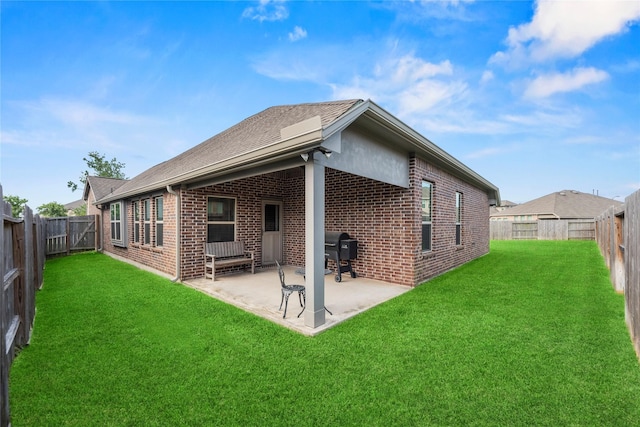 20122 Matador Ridge Dr, Cypress, TX 77433 - rear view of house with brick siding, a patio, and roof with shingles