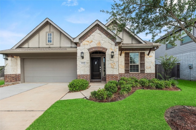 20122 Matador Ridge Dr, Cypress, TX 77433 - view of front of home featuring stone siding, stucco siding, a garage, and concrete driveway
