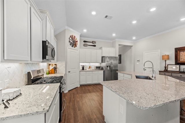 20122 Matador Ridge Dr, Cypress, TX 77433 - kitchen with appliances with stainless steel finishes, a sink, crown molding, dark wood-style floors, and white cabinets