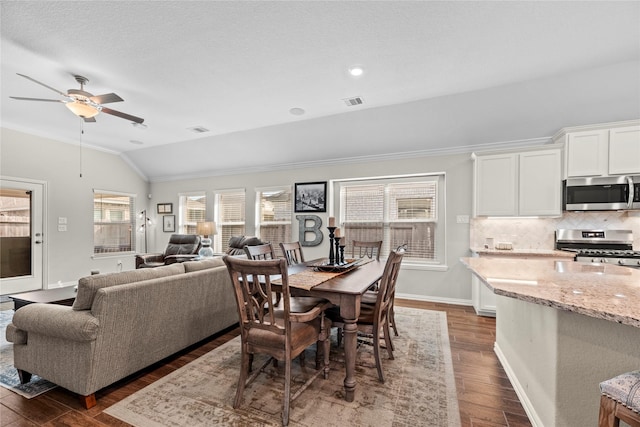 20122 Matador Ridge Dr, Cypress, TX 77433 - dining space featuring lofted ceiling, ornamental molding, a ceiling fan, dark wood-style floors, and baseboards
