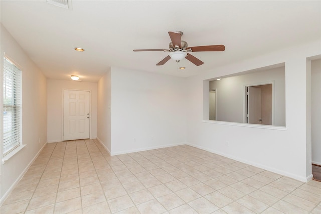 21202 Fire Wind Ct, Spring, TX 77379 - empty room with ceiling fan, recessed lighting, light tile patterned floors, and baseboards