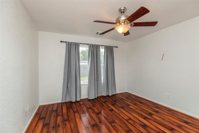 21202 Fire Wind Ct, Spring, TX 77379 - empty room with dark wood-style flooring, a ceiling fan, and baseboards