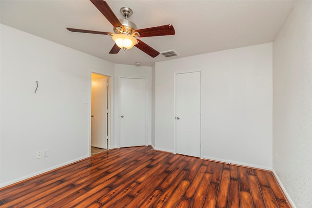 21202 Fire Wind Ct, Spring, TX 77379 - unfurnished bedroom with wood finished floors, baseboards, and a ceiling fan