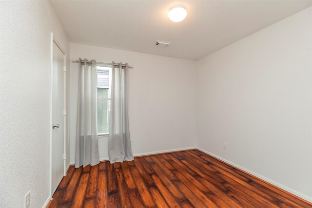 21202 Fire Wind Ct, Spring, TX 77379 - unfurnished room featuring dark wood finished floors and baseboards