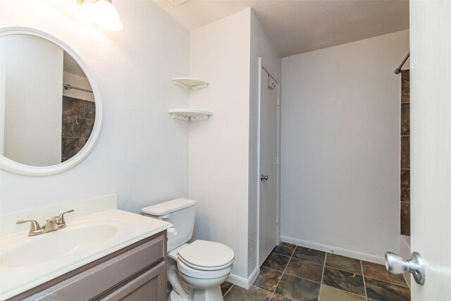 21202 Fire Wind Ct, Spring, TX 77379 - full bath with toilet, vanity, and baseboards