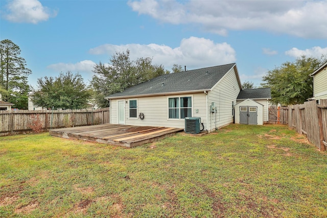 21202 Fire Wind Ct, Spring, TX 77379 - back of house with cooling unit, a wooden deck, a storage shed, and an outbuilding
