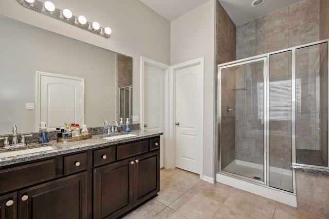 237 Catoti Cay Ct, Conroe, TX 77304 - bathroom featuring a stall shower, tile patterned flooring, and double vanity