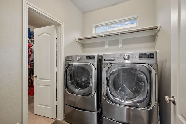 237 Catoti Cay Ct, Conroe, TX 77304 - laundry area with washing machine and dryer and carpet