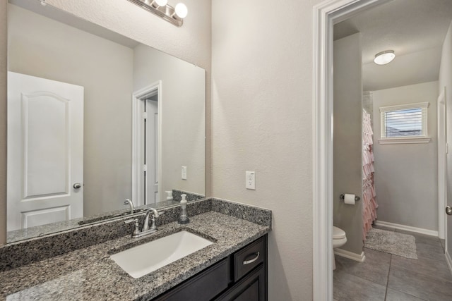 237 Catoti Cay Ct, Conroe, TX 77304 - full bathroom with toilet, tile patterned flooring, vanity, and a shower with shower curtain