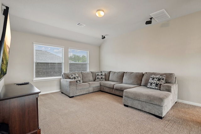 237 Catoti Cay Ct, Conroe, TX 77304 - living area featuring light carpet, baseboards, and vaulted ceiling