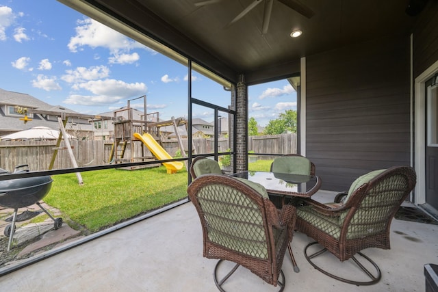 237 Catoti Cay Ct, Conroe, TX 77304 - sunroom with ceiling fan, a residential view, and outdoor dining area