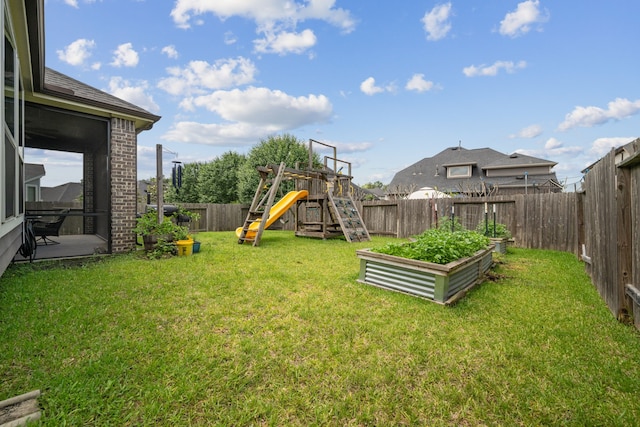 237 Catoti Cay Ct, Conroe, TX 77304 - view of yard featuring a playground and a garden