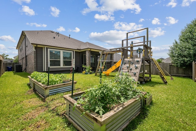 237 Catoti Cay Ct, Conroe, TX 77304 - view of play area featuring a vegetable garden and central AC unit