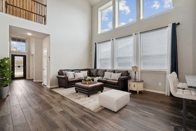 237 Catoti Cay Ct, Conroe, TX 77304 - living area with a towering ceiling, dark wood finished floors, and baseboards