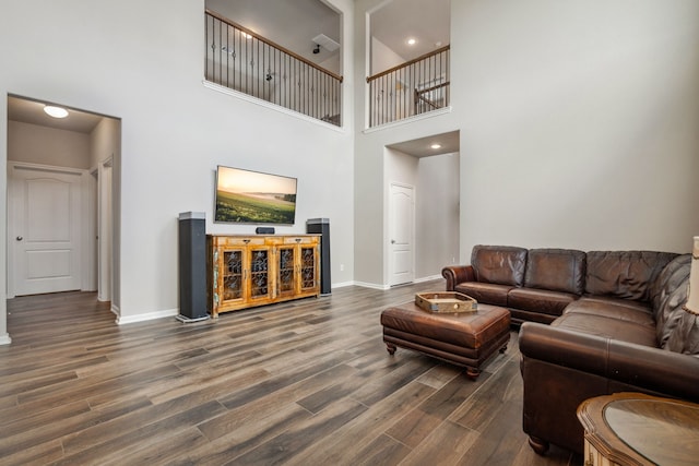 237 Catoti Cay Ct, Conroe, TX 77304 - living room featuring wood finished floors, baseboards, and a towering ceiling