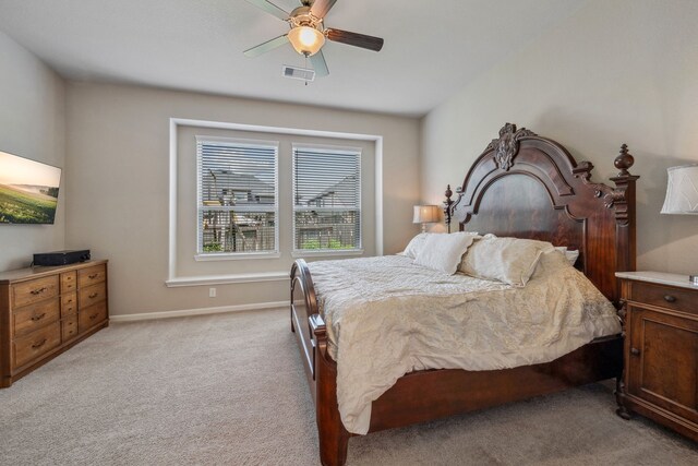 237 Catoti Cay Ct, Conroe, TX 77304 - bedroom featuring light carpet, ceiling fan, and baseboards