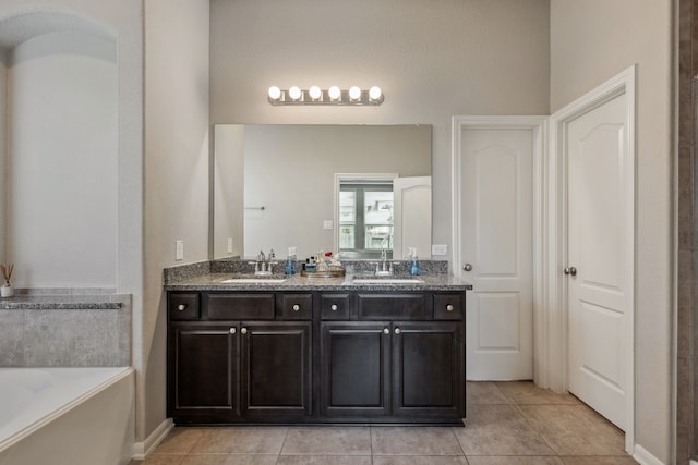 237 Catoti Cay Ct, Conroe, TX 77304 - full bathroom with a garden tub, double vanity, and tile patterned flooring